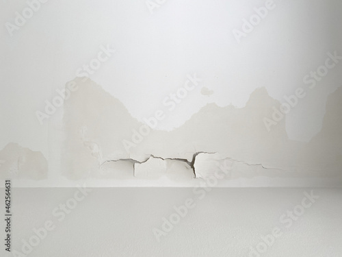whitewash and plaster of ceiling crack and break from rain leakage from roof or top floor
