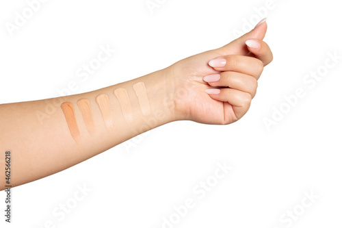 Female hand with swatches of a cosmetic foundation photo