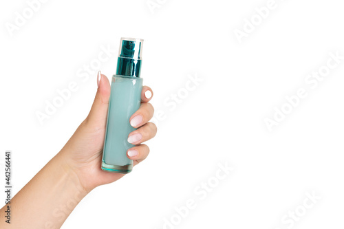 Woman holding moisturising cream, isolated