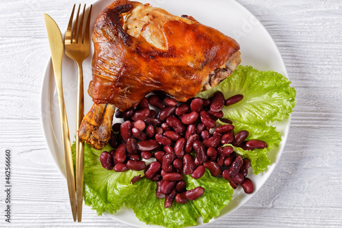 roasted pork shanks with red beans on a plate