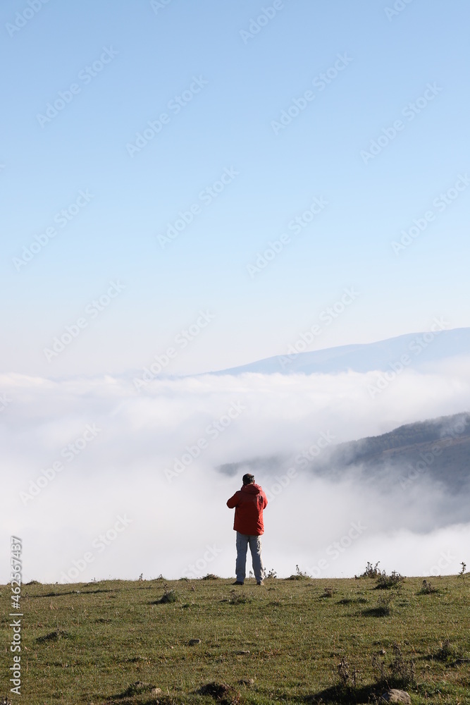 people hiking and taking pictures in the mountain early in the morning