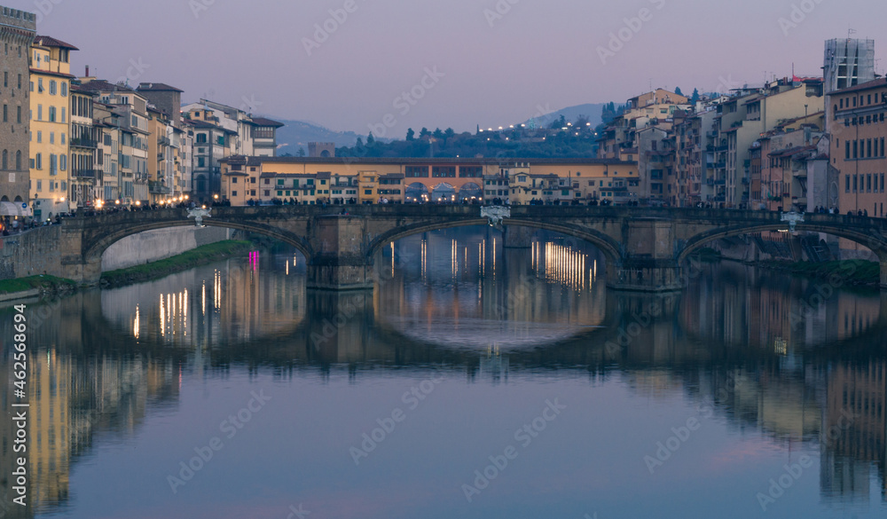 Evening view of the Arno River with reflections