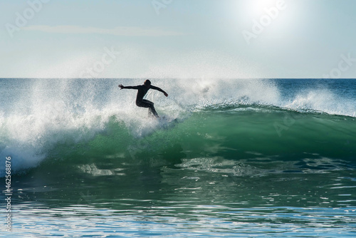 confirmed surfer in action in big waves