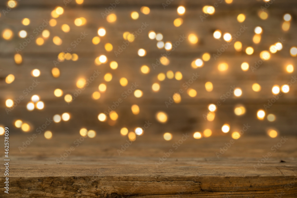 Wooden holiday background with defocused lights
Wooden holiday background with defocused lights