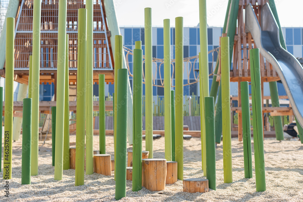 Fototapeta premium children's playground with a slide and a sandy surface without people. High quality photo