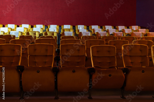 Inside empty cinema movie theater with yellow seats