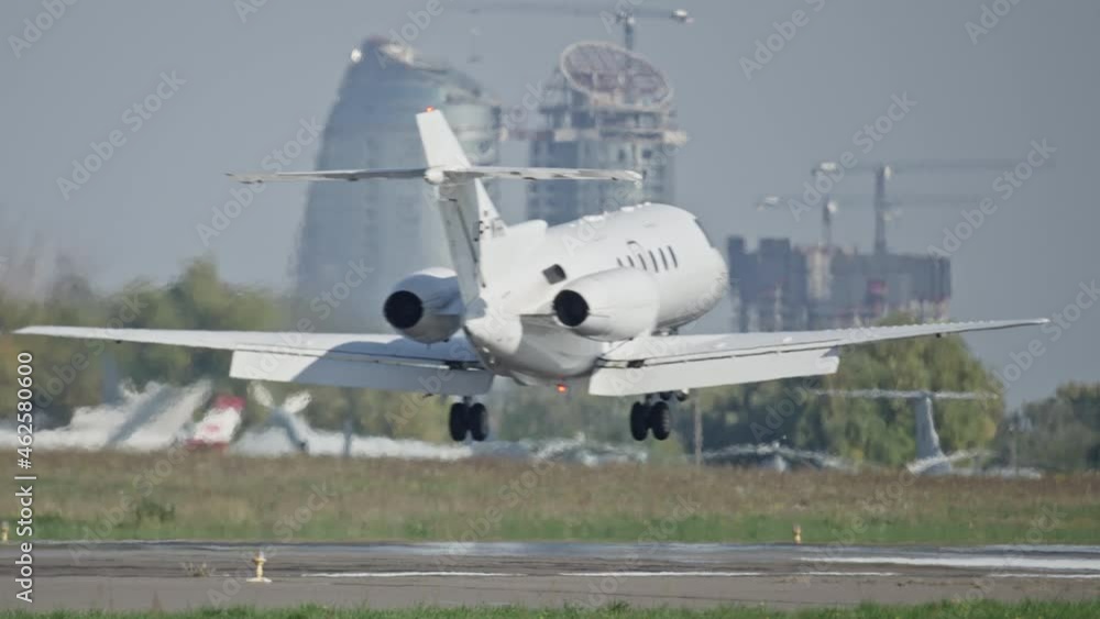 Slow motion video of landing a private jet. A small plane lands on the runway. Slow motion video of landing a private jet. A small plane lands on the runway.