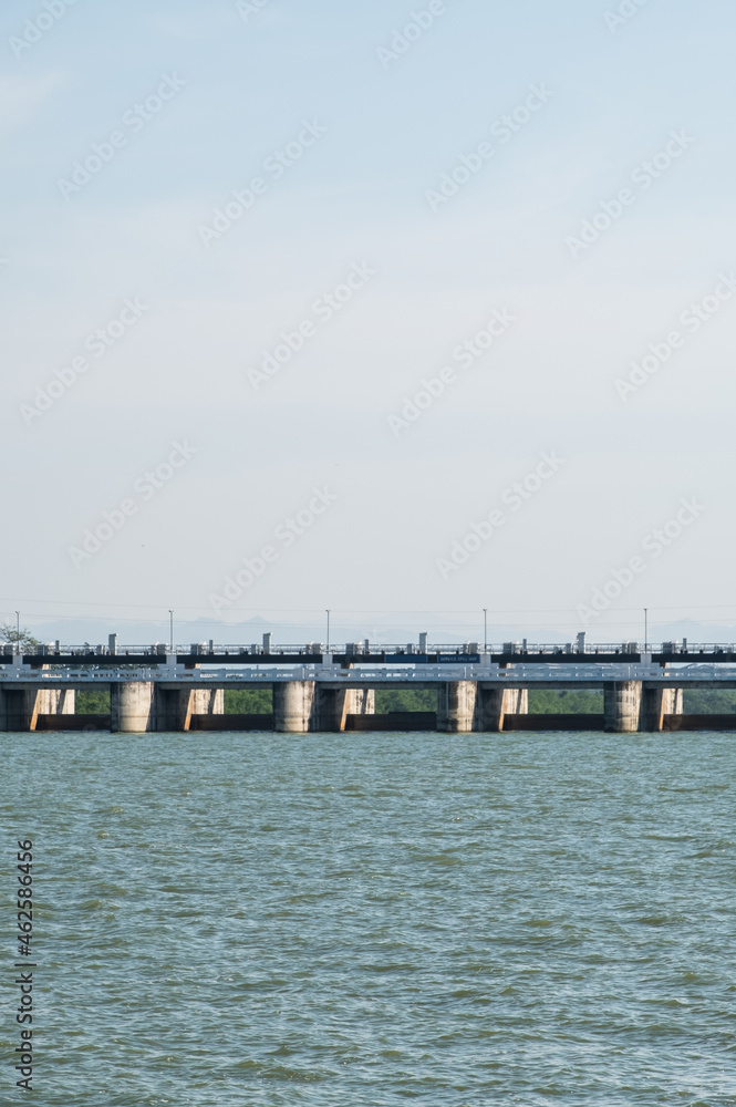 The many large gates of the service spillway on the reservoir dam.