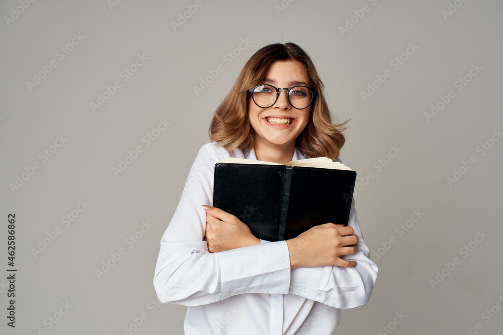 female manager with folder for papers Professional light background female manager with folder for papers Professional light background