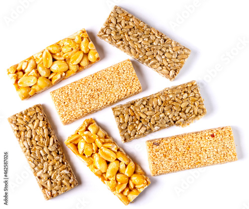 Rectangular pieces of kozinak - sunflower, peanut and sesame seeds. Isolated on white background. Close-up. Top view.