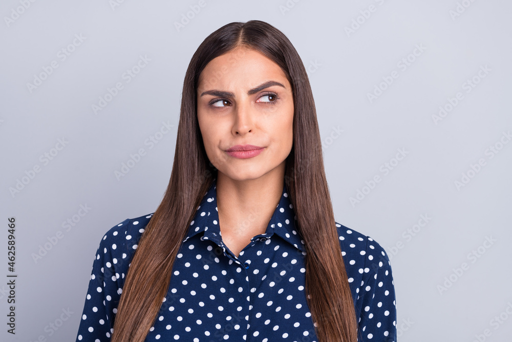 Photo of minded serious young woman look empty space idea plan wonder isolated on grey color background Photo of minded serious young woman look empty space idea plan wonder isolated on grey color background