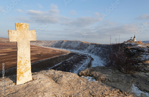 Cross and old Orheil monastery photo