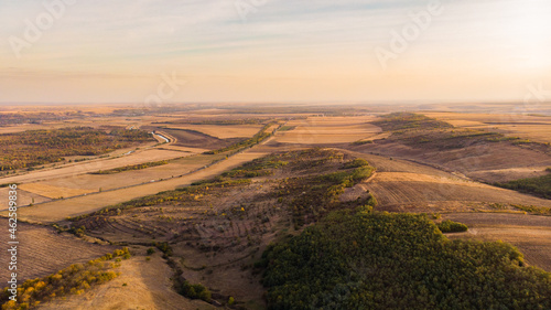Aerial drone landscape over the hill by the sunset