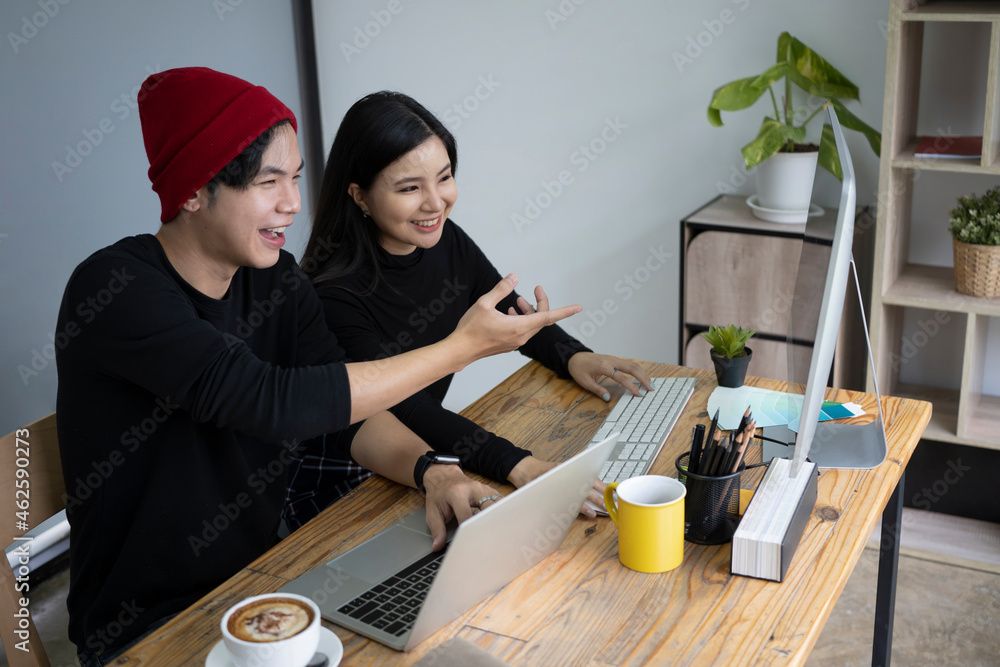 Cheerful creative people discussing project together in office. Cheerful creative people discussing project together in office.