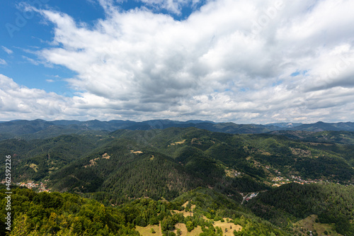 View to mountain and forest with cloudy sky