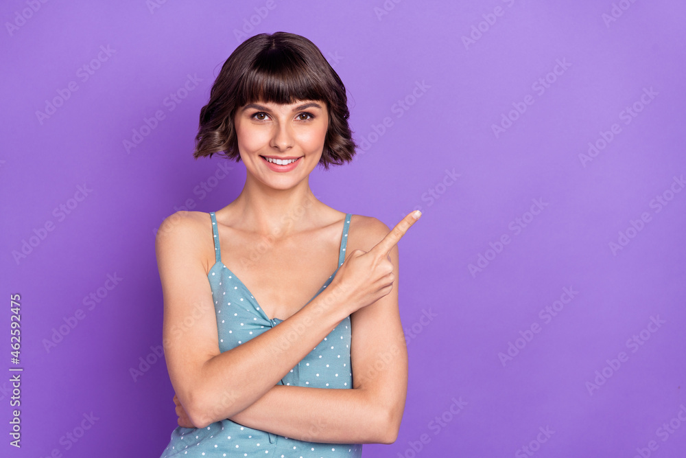 Portrait of attractive cheerful girl demonstrating copy space ad isolated over bright violet purple color background Portrait of attractive cheerful girl demonstrating copy space ad isolated over bright violet purple color background