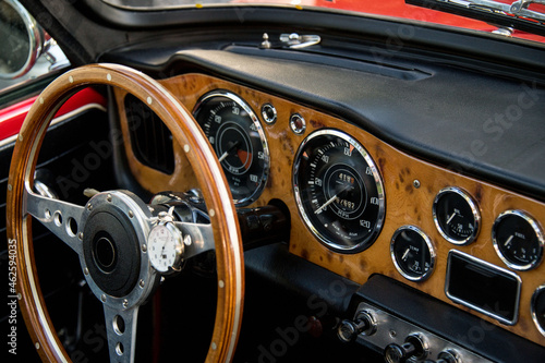 cockpit of classic car with gauges and steering wheel © PictureSyndicate