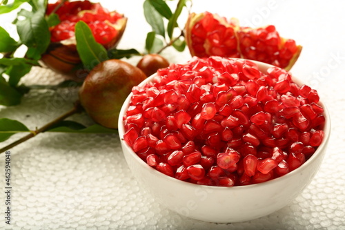 Bowl of organic sweet ripe pomegranate seeds. healthy diet food.