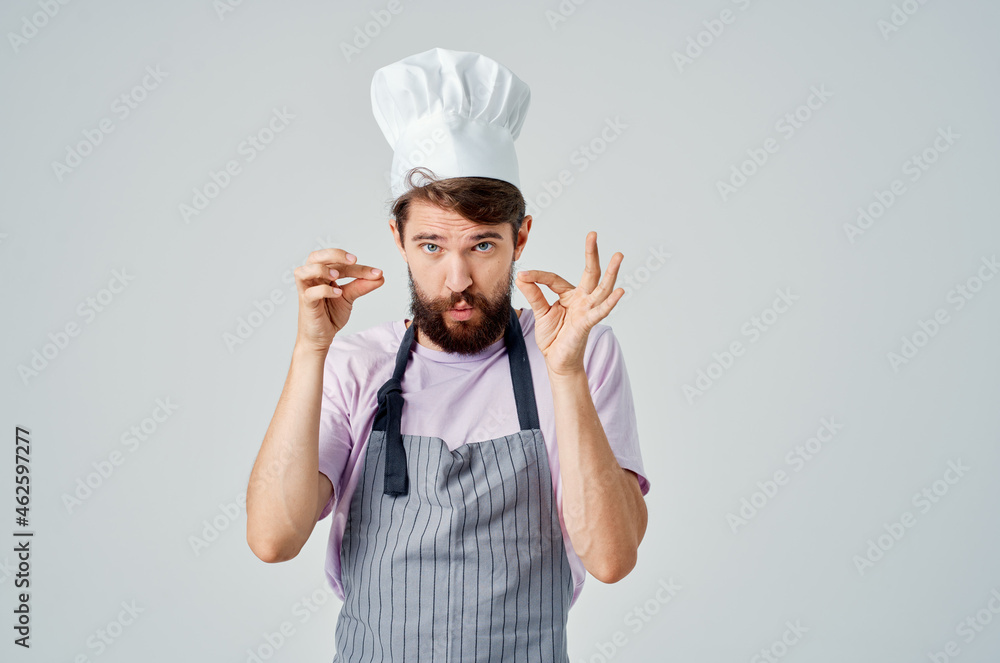a man in a chef's hat emotions of professionals work in a restaurant a man in a chef's hat emotions of professionals work in a restaurant