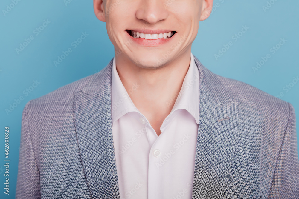 Cropped photo of young man chappy positive smile oral care teeth clinic dentistry isolated over blue color background Cropped photo of young man chappy positive smile oral care teeth clinic dentistry isolated over blue color background