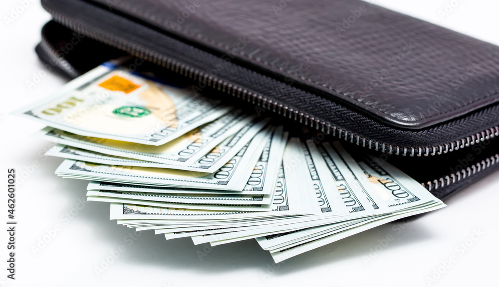 Wallet with money. US dollars close up. Cash in a man's wallet isolated on white background. Financial well-being. Good cash income, wages. Wealthy person. Wallet with money. US dollars close up. Cash in a man's wallet isolated on white background. Financial well-being. Good cash income, wages. Wealthy person.