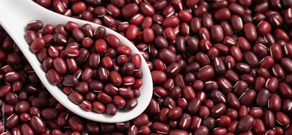 Raw adzuki red bean as background with spoon. Raw adzuki red bean as background with spoon.