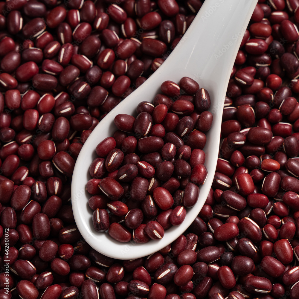 Raw adzuki red bean as background with spoon. Raw adzuki red bean as background with spoon.