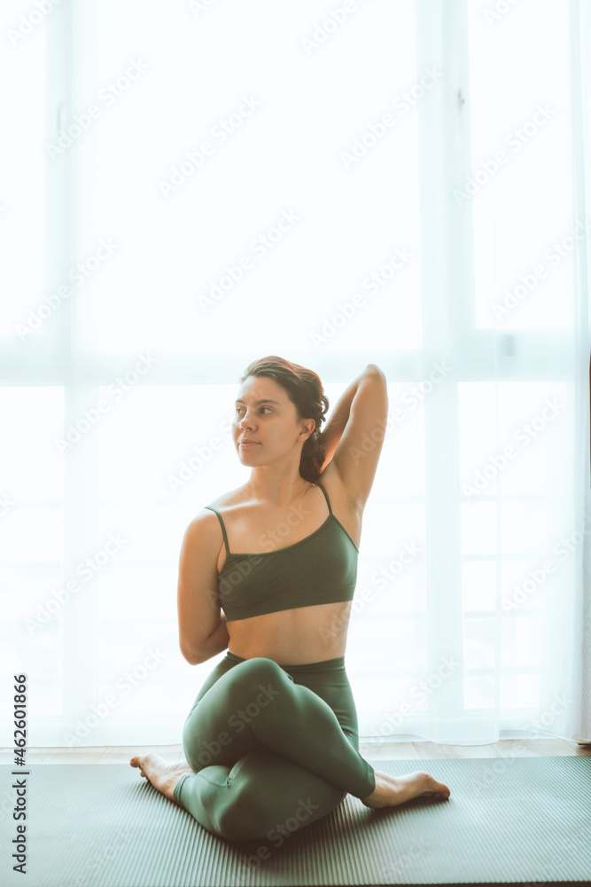 woman do yoga at home near big window woman do yoga at home near big window