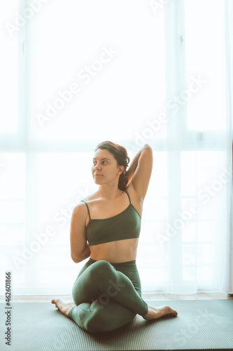 Free Download woman do yoga at home near big window - GFXLoad