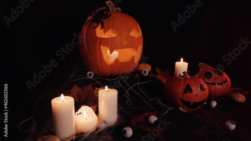 Halloween Decoratins on Table. Halloween Pumpkin. Traditional Treats. photo