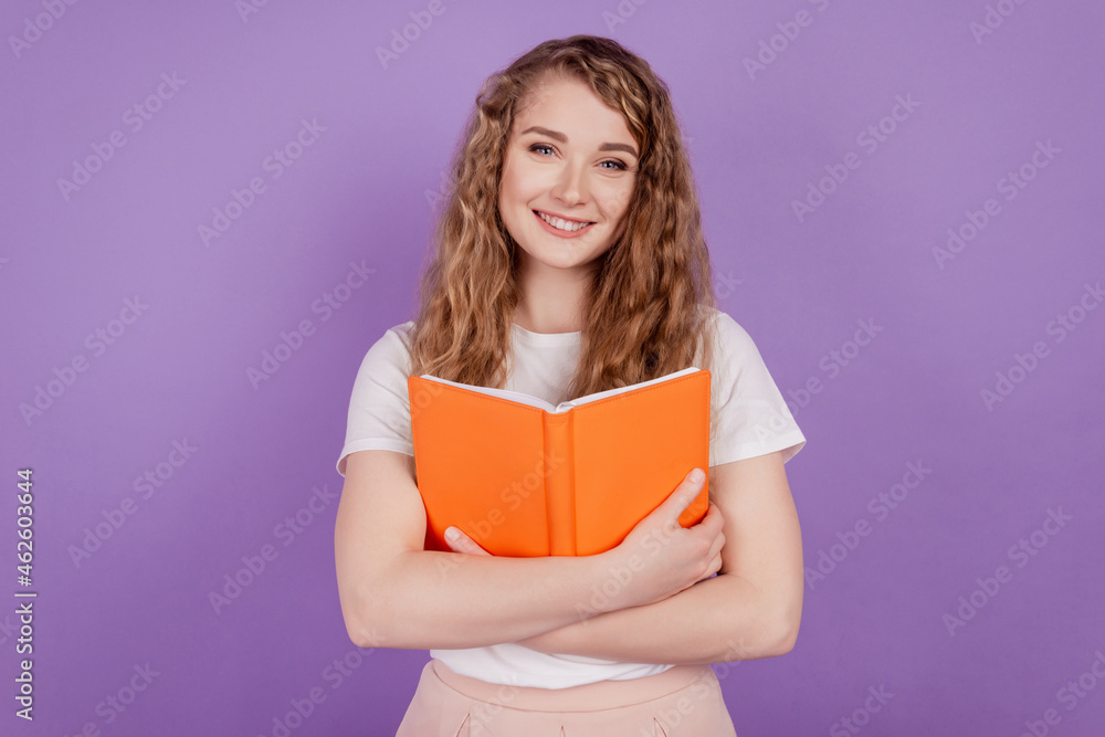Photo of inspired clever student lady hands embrace book love story wear casual outfit on purple background Photo of inspired clever student lady hands embrace book love story wear casual outfit on purple background
