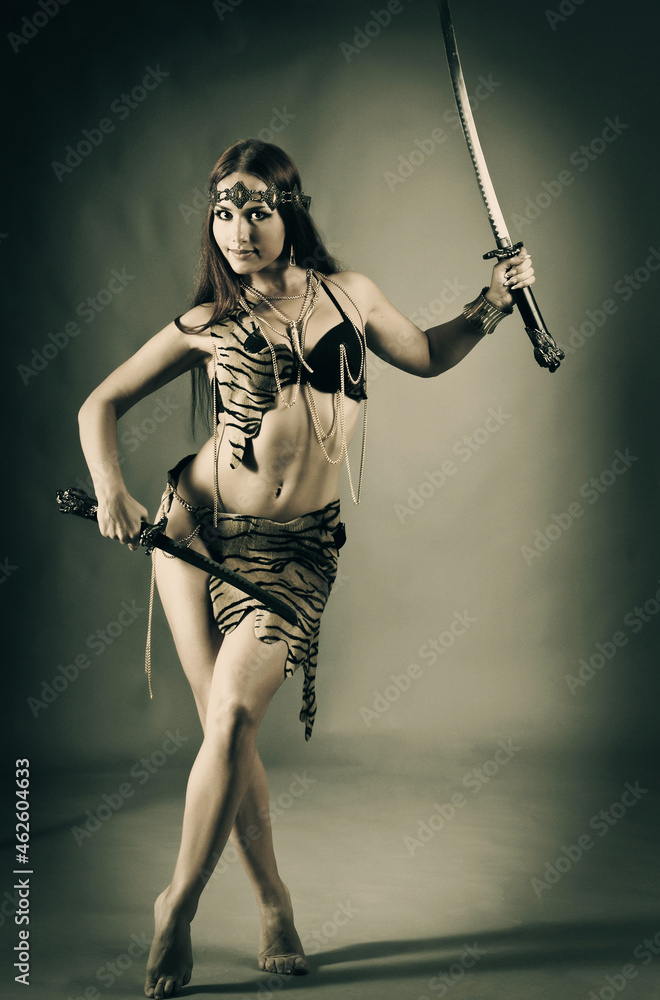 warrior woman holding sword in her hand warrior woman holding sword in her hand
