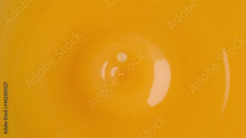 Orange Juice Droplet Making Splash Crown in Slow Motion and Macro