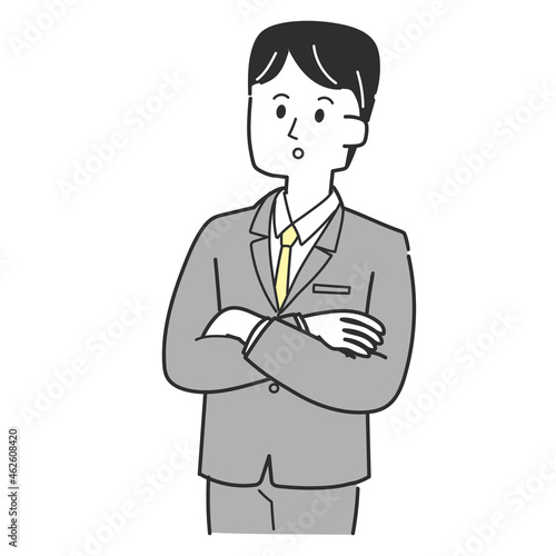 考え事をしているスーツの男性