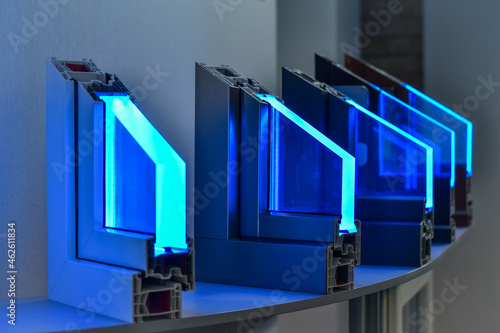 Принти на полотні Different types of plastic window profiles PVC exhibited in store,  with neon lighting