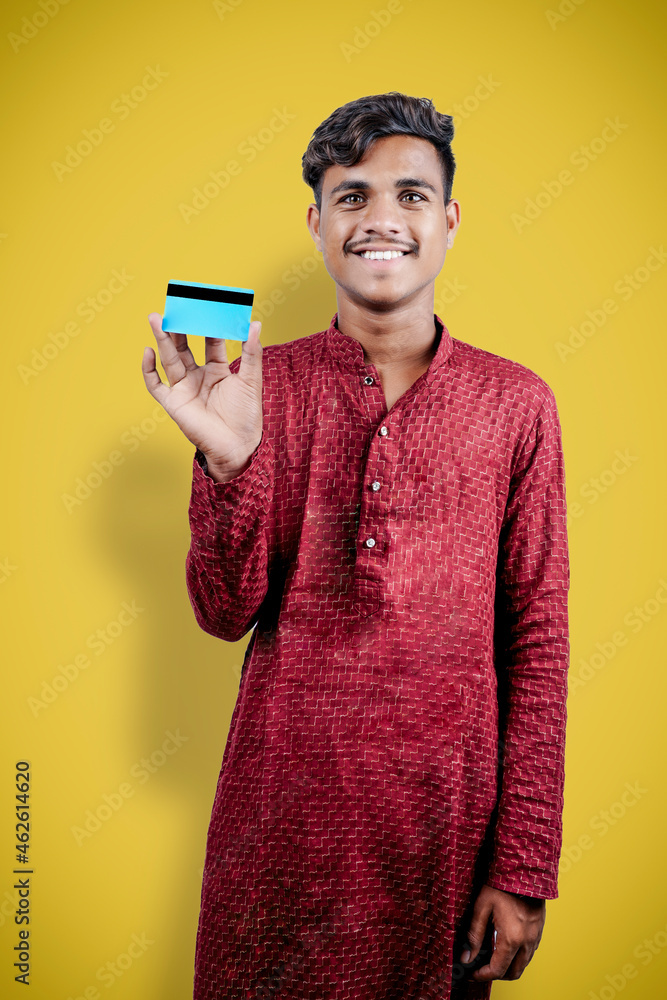 indian man holding bank card or business card indian man holding bank card or business card