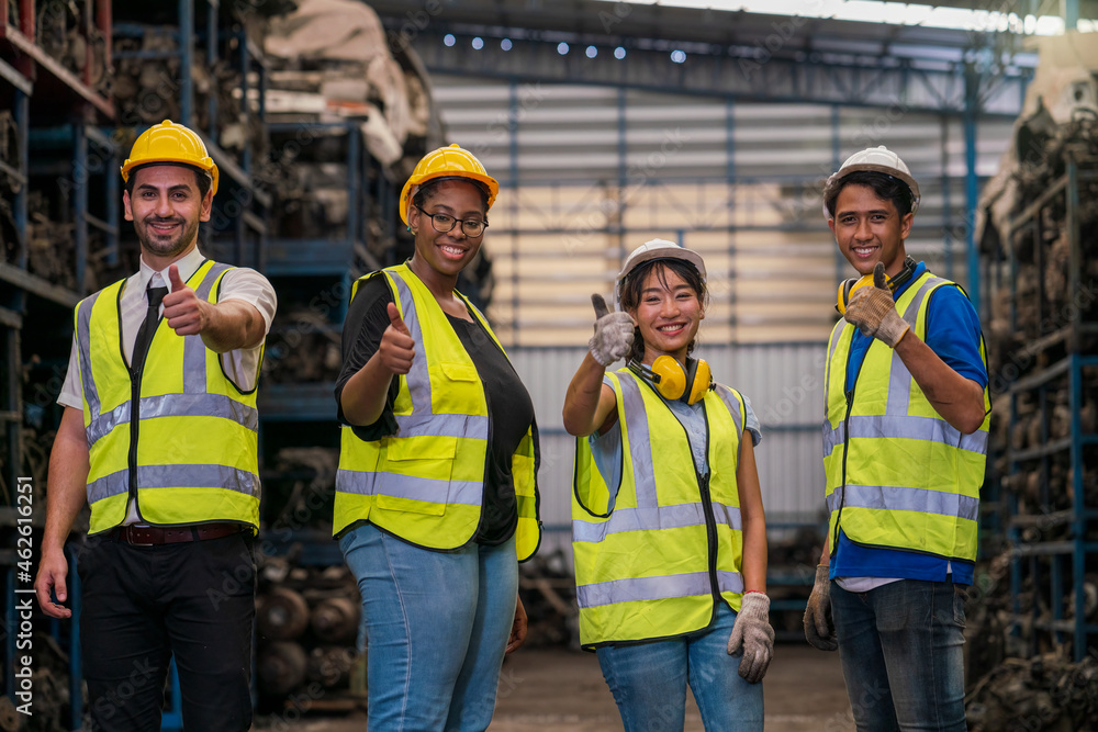Group of employees and engineers in industrial plants. Team of workers and engineer showing thumb up in Factory at production. Group of employees and engineers in industrial plants. Team of workers and engineer showing thumb up in Factory at production.