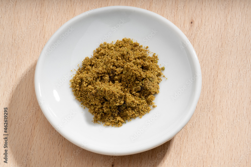 Detailed and large close up shot of cumin on a small plate Detailed and large close up shot of cumin on a small plate