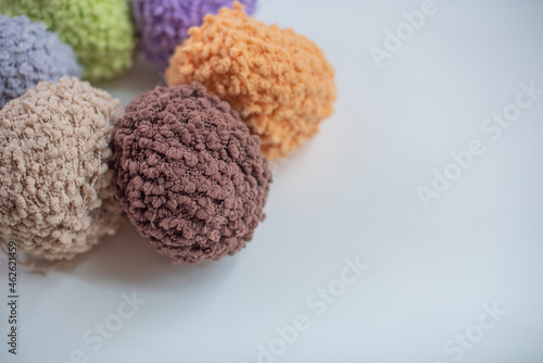 Knitting needles, colorful threads. Knitting pattern of colorful yarn wool on shopfront. Knitting background. Knitting yarn for handmade winter clothes. Colorful background with yarn ball.