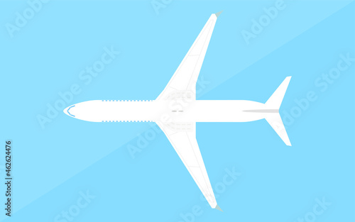 シンプルな飛行機の模型、青背景 © TKM