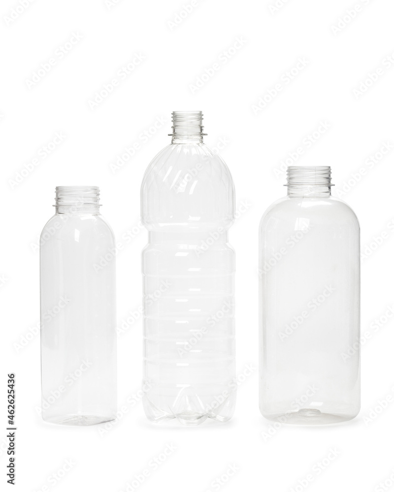 three different empty plastic bottles isolated on white background. production of new containers three different empty plastic bottles isolated on white background. production of new containers