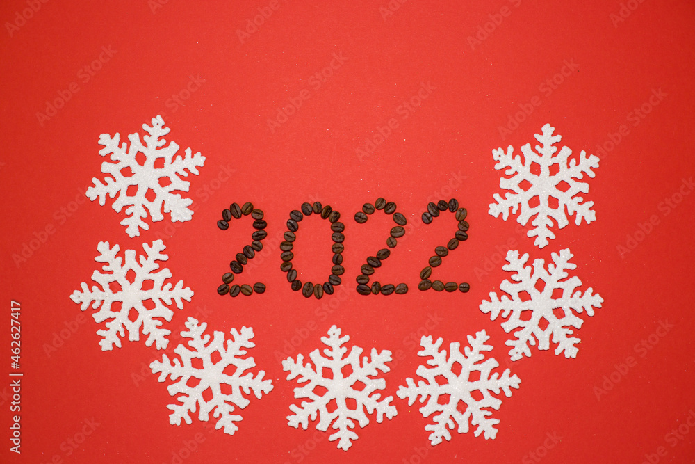 The numbers 2022 on a red background with white snowflakes. Figures 2022 from coffee beans. Coffee beans. New Year 2022. White snowflakes on a red background. The numbers 2022 on a red background with white snowflakes. Figures 2022 from coffee beans. Coffee beans. New Year 2022. White snowflakes on a red background.