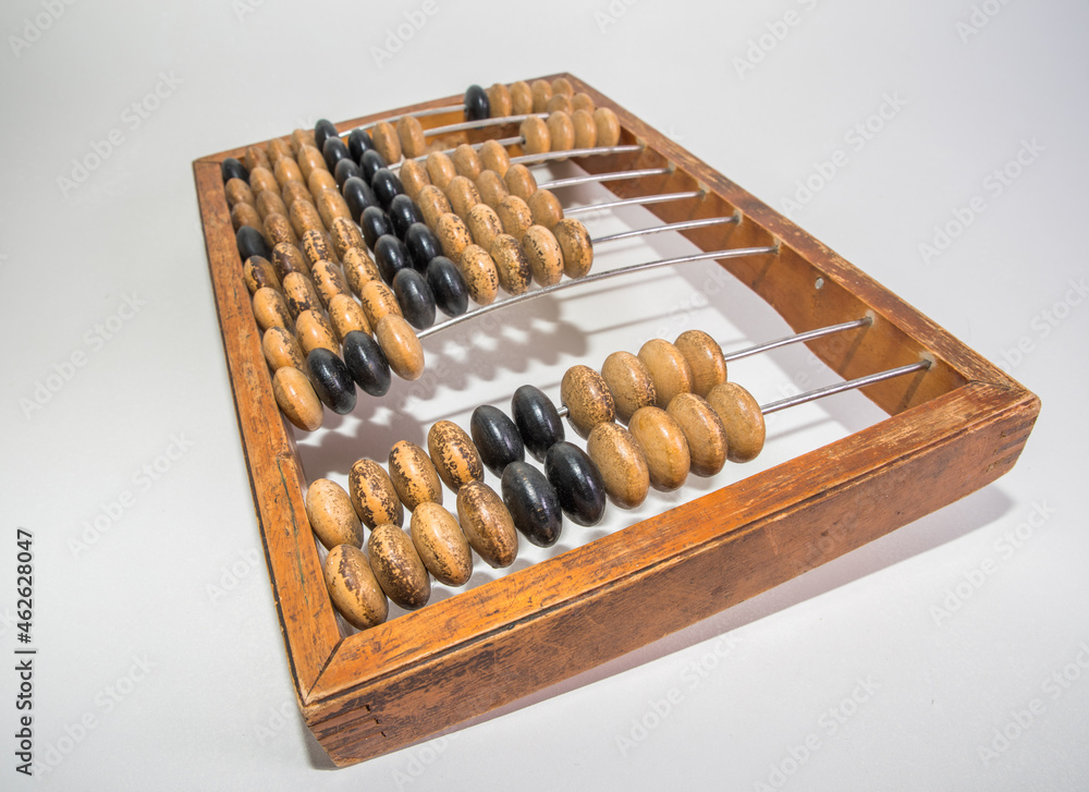 Old wooden abacus on pure white background Old wooden abacus on pure white background