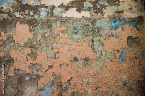 The texture of peeled paint on an old plastered wall