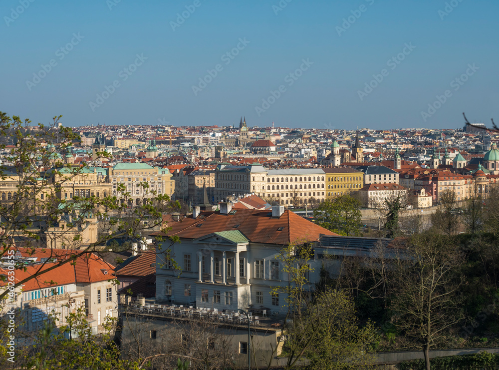 Scenic aerial view of Prague Old Town architecture roof top seen from Letna hill park, spring sunny day, blue sky, Czech Republic