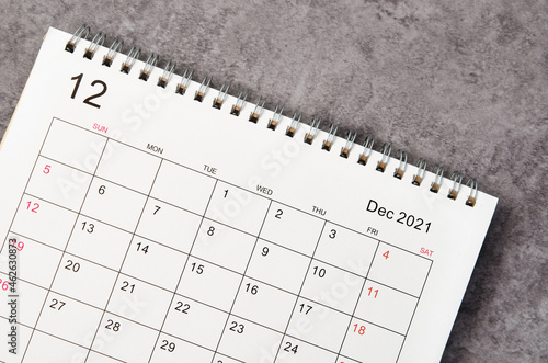 December desk calendar 2022 on wooden background. © gamjai