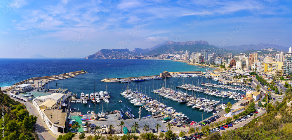 Marina next to the resort town with a multitude of yachts and sailing boats. Calpe Alicante.