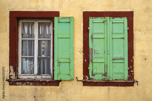 View of two windows in a house in need of renovation  © fotografci