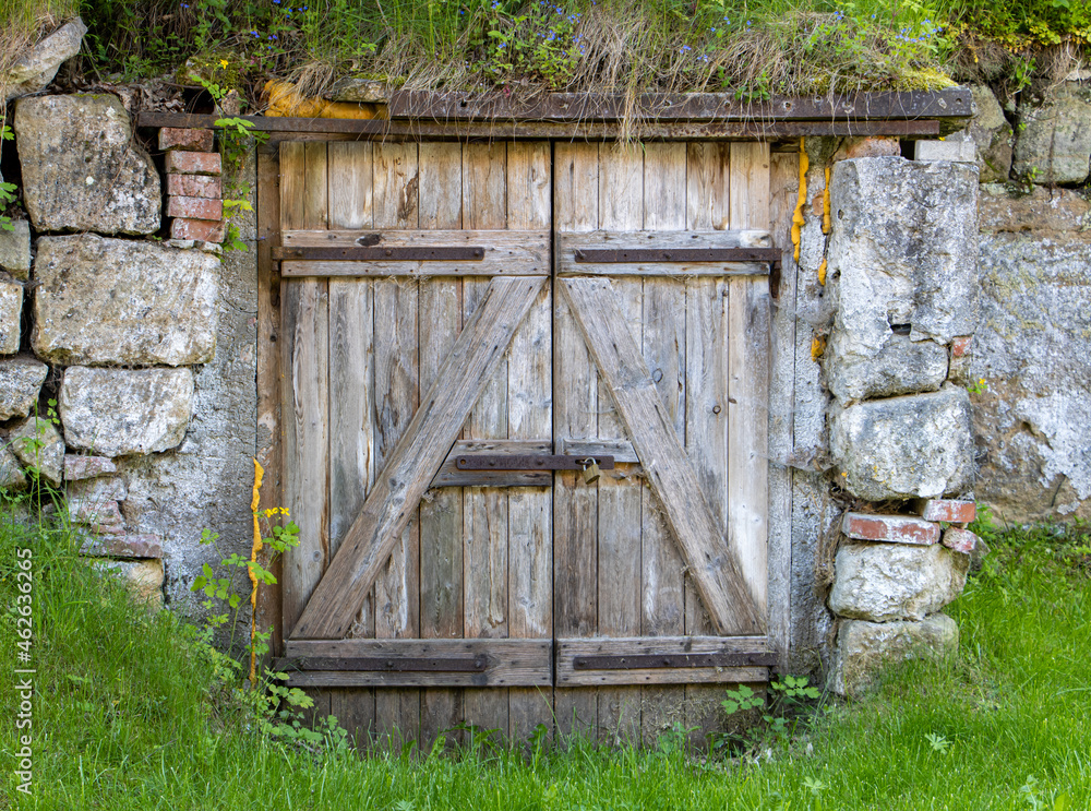 A closed gate of the outdoors cellar on czech countryside A closed gate of the outdoors cellar on czech countryside