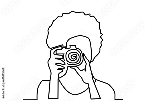 female figure holding the camera close to her eye to take a photo. Female photographer drawn in one line on a white background. Logo for photography education and female photographer logo